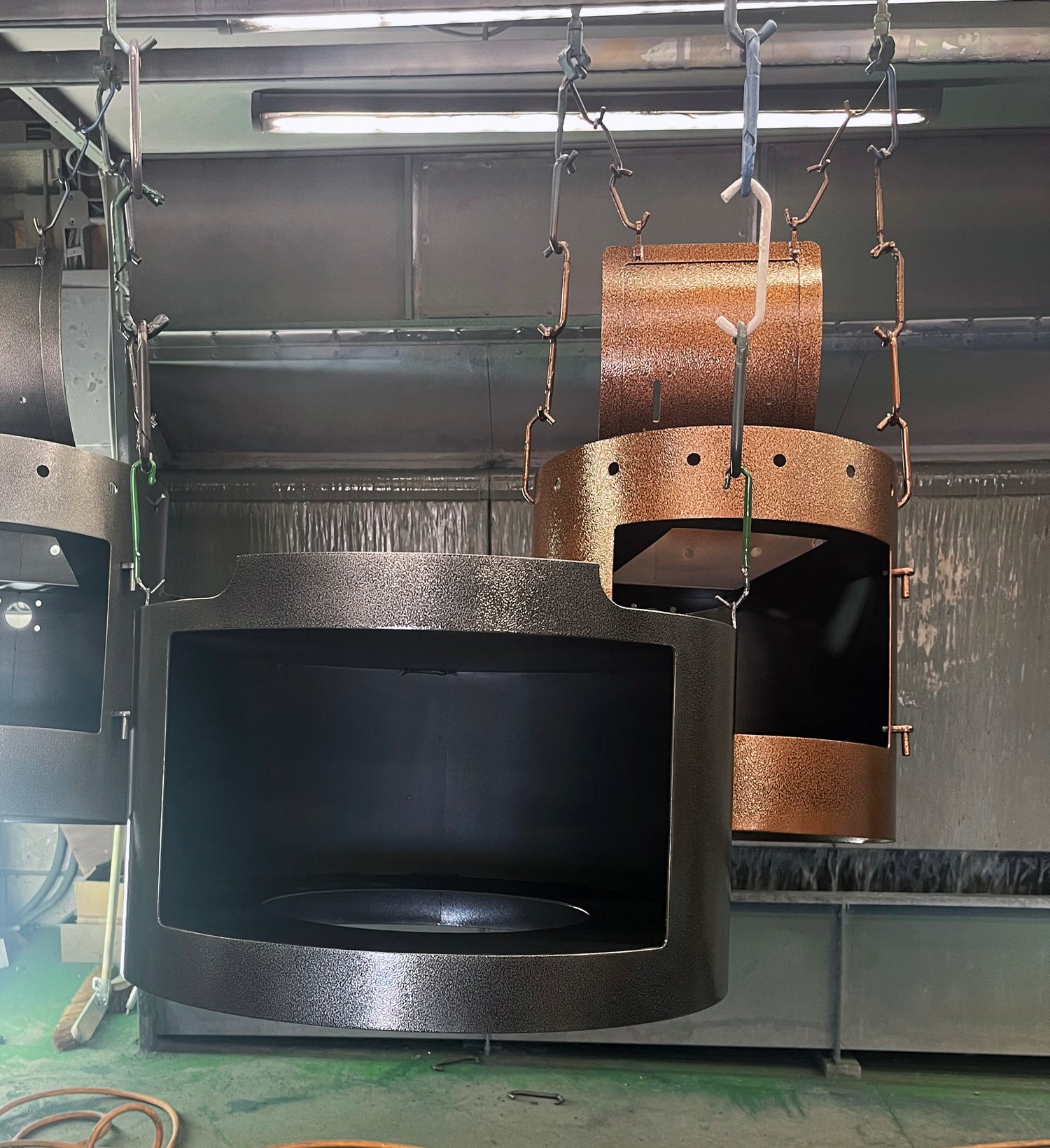 BBQ Stoves hanging at our facilities handmade to order and in bronze and silver colourways